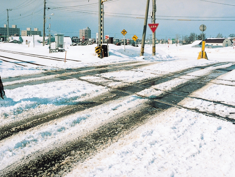 Antifreezing agent for railroad crossings