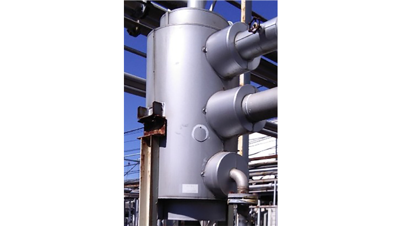 This is a photograph of the PFC cooling and recovery condenser attached to the PFC tank.