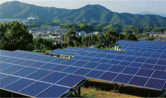 This is an image of solar panels installed outdoors near the mountains.